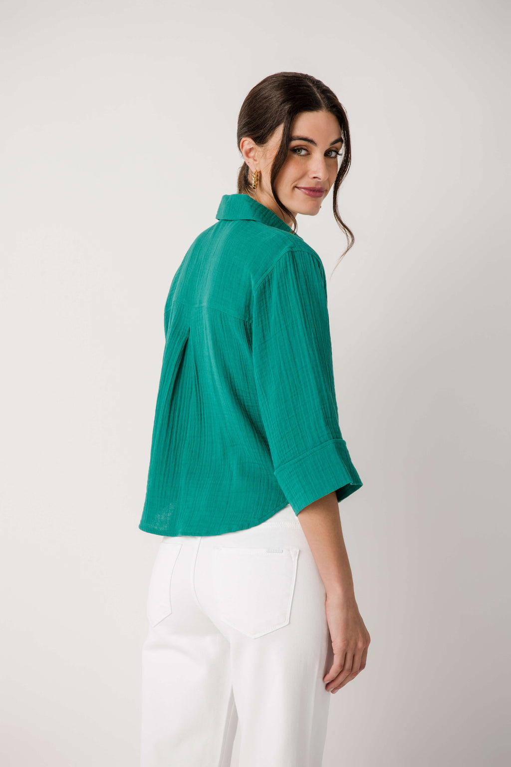 Rainforest green button-front shirt back/side view with rolled three-quarter sleeves
