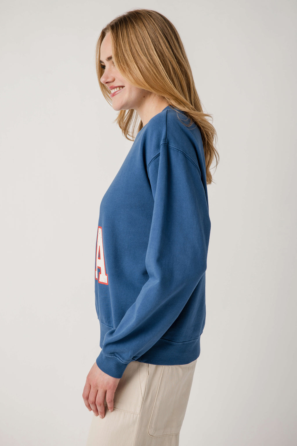 True navy sweatshirt with partial 'USA' graphic, long sleeves, ribbed cuffs