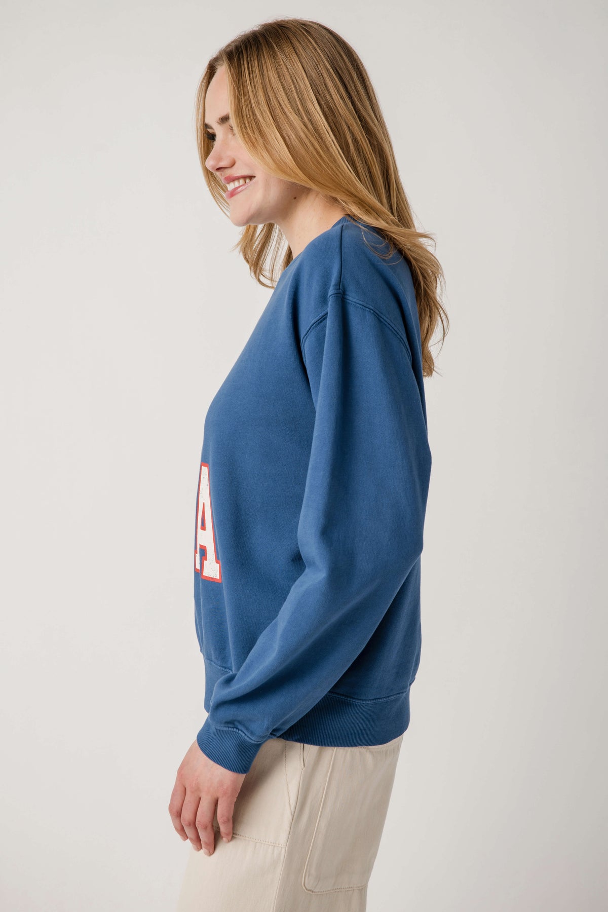 True navy sweatshirt with partial 'USA' graphic, long sleeves, ribbed cuffs