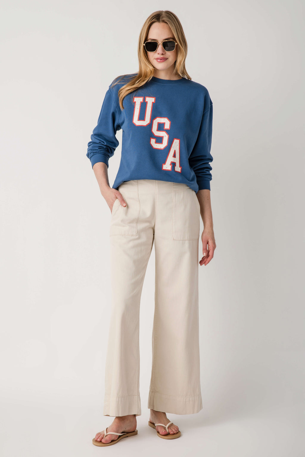 Beige denim pull-on pants with patch pockets and wide leg opening