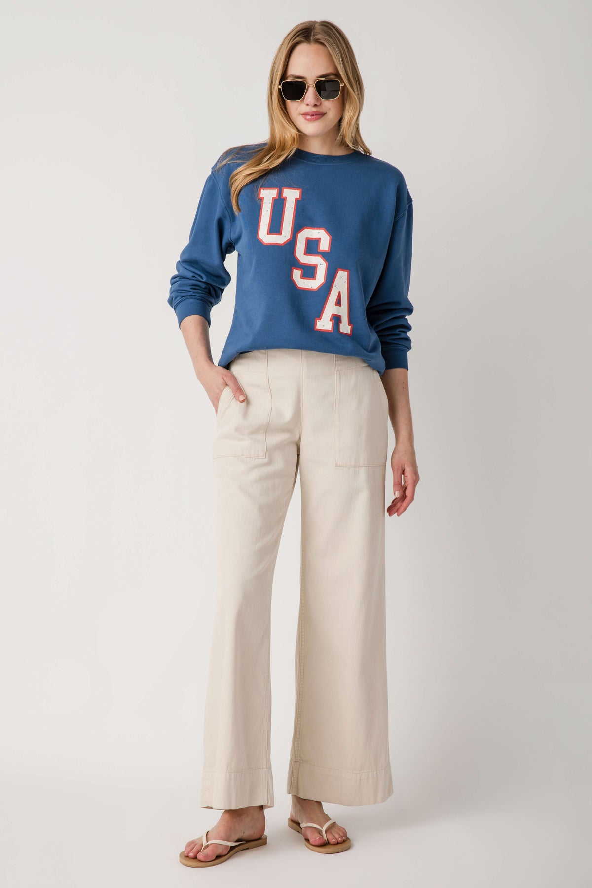 Beige denim pull-on pants with patch pockets and wide leg opening