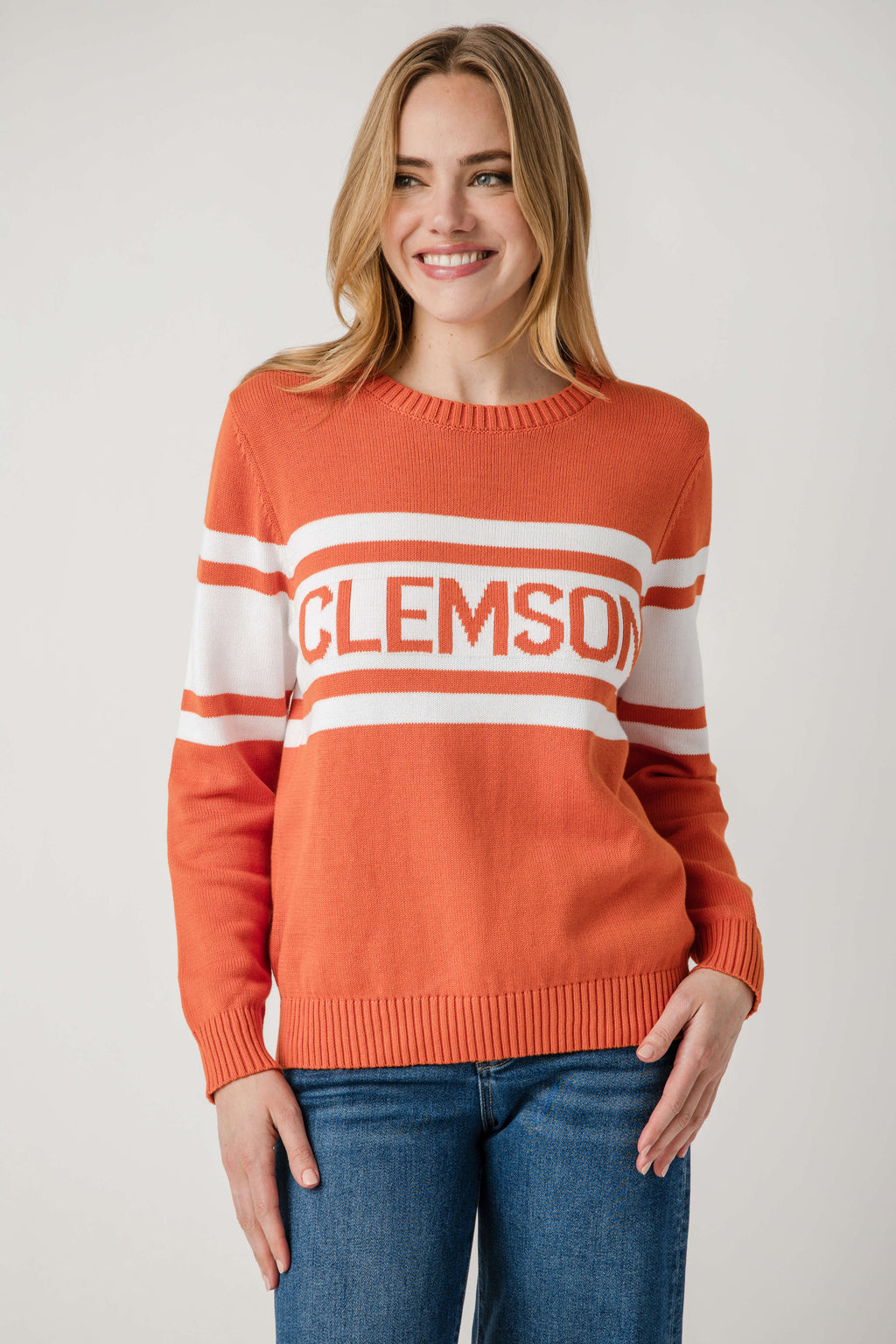 Orange crewneck sweater with Clemson text logo and wide white stripe bands