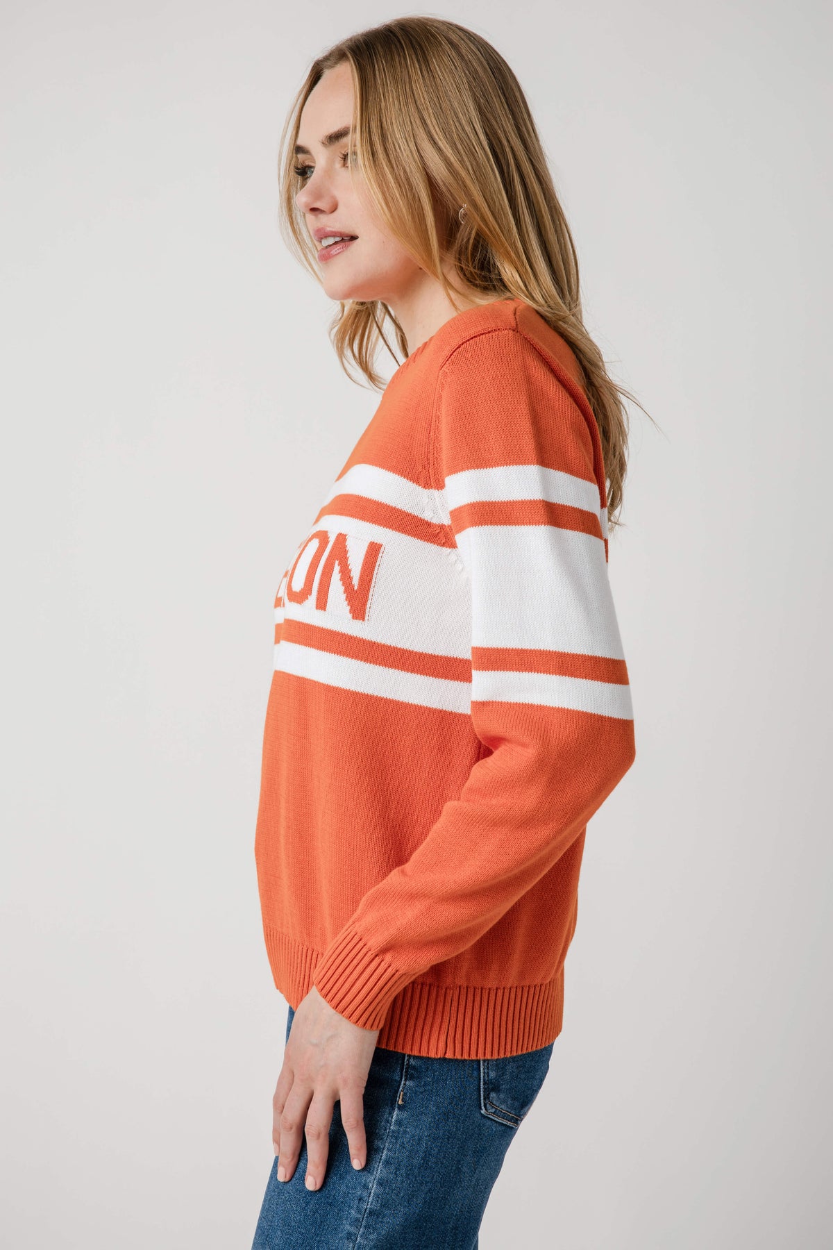 Orange Clemson crewneck sweater with white striped sleeve detail, ribbed hem