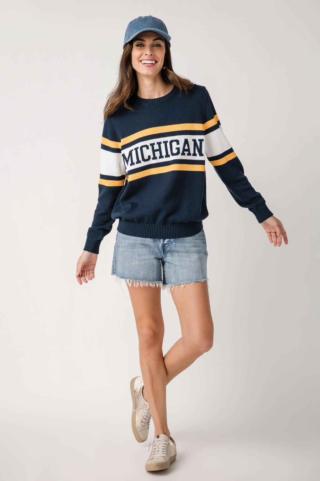 Navy vintage campus sweater with Michigan logo, white and gold stripe detailing
