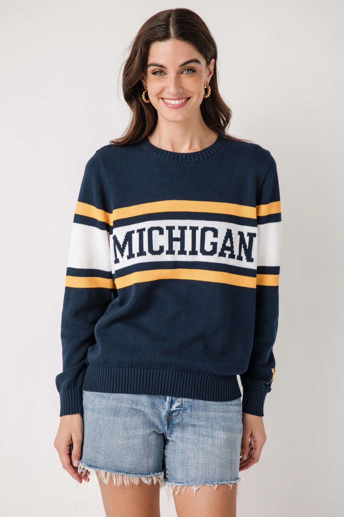 Navy vintage Michigan crewneck sweater with bold white-and-gold stripe band