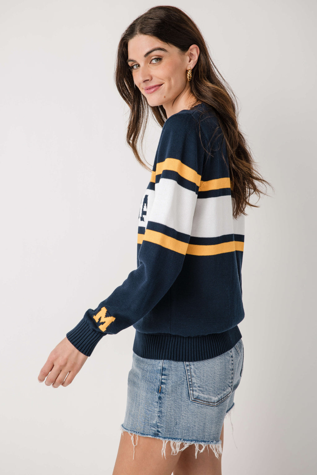 Navy vintage Michigan sweater with white-and-gold stripes and small chest emblem