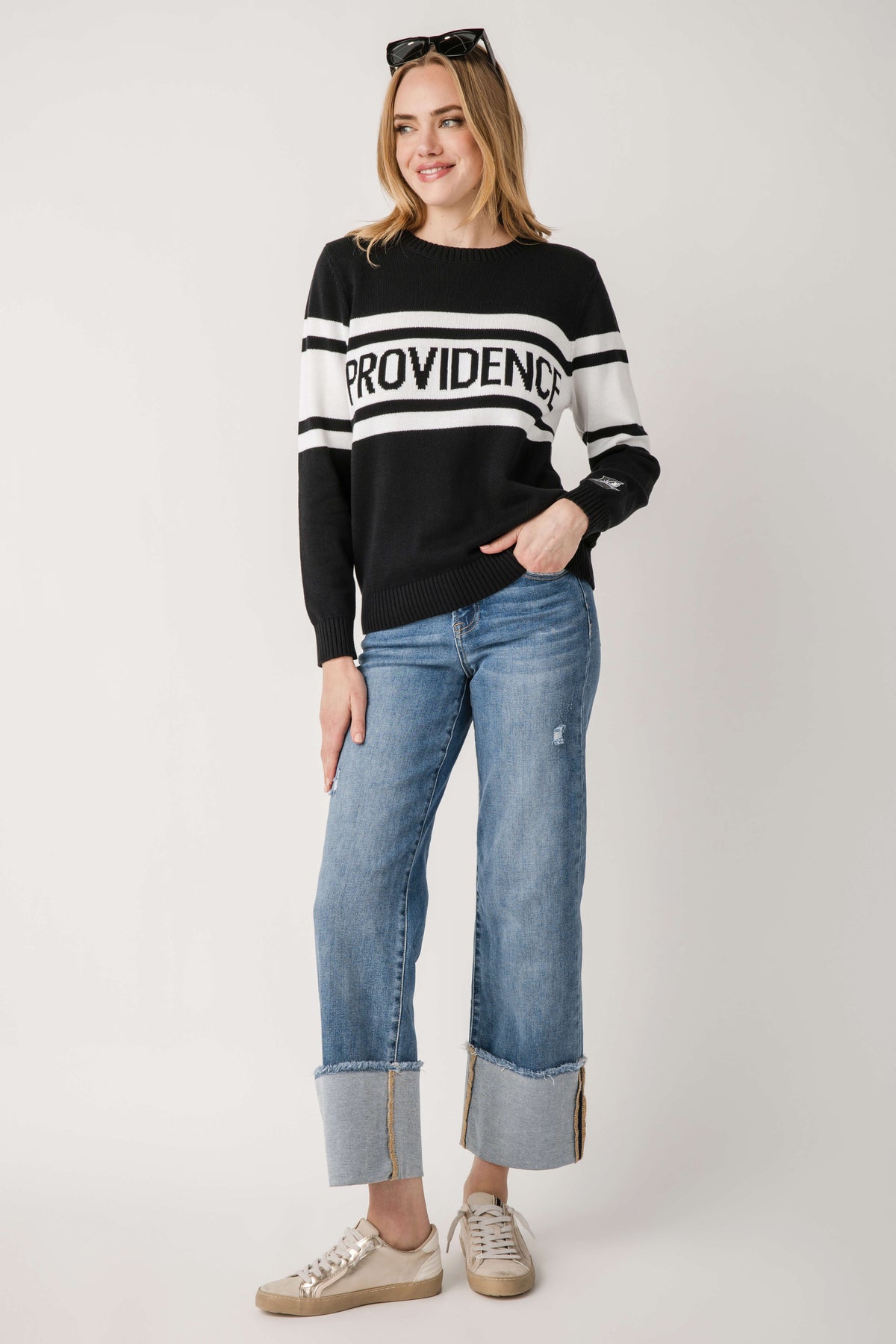 Black vintage campus sweater with white striped band and Providence logo across chest
