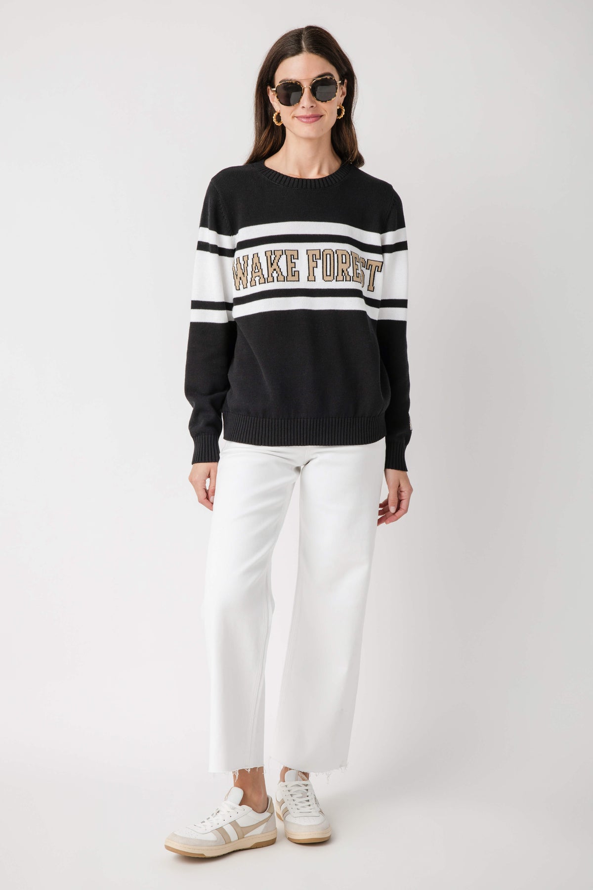 Black sweatshirt with white chest stripes, Wake Forest logo, and long sleeves