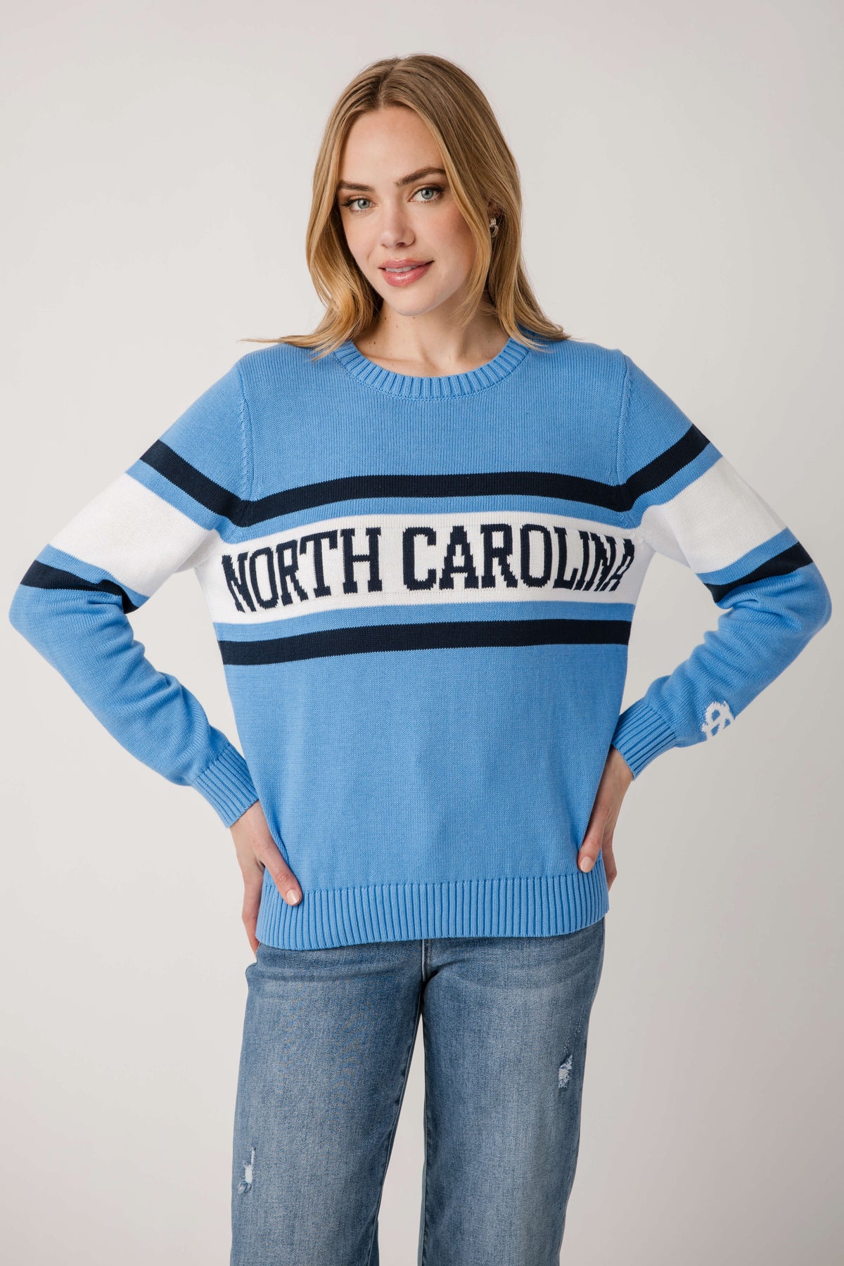 Vintage campus sweater in light blue with white and dark blue stripes and North Carolina logo