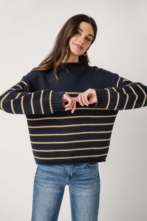 Navy striped mockneck knit sweater with gold and cream horizontal lines, crew-like collar.