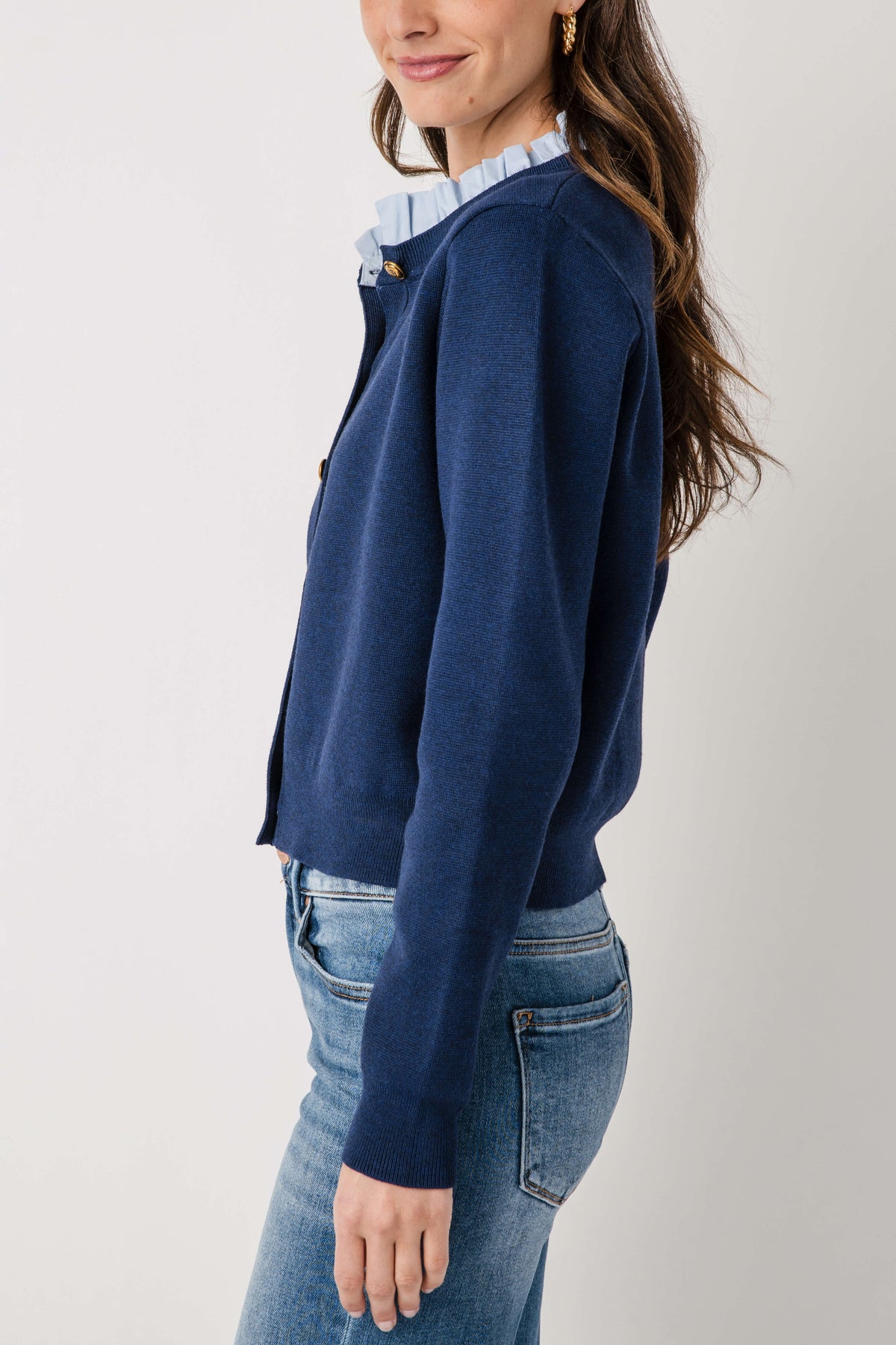 Navy ruffle-collar cardigan with button-front, long sleeves, shoulder tab detail