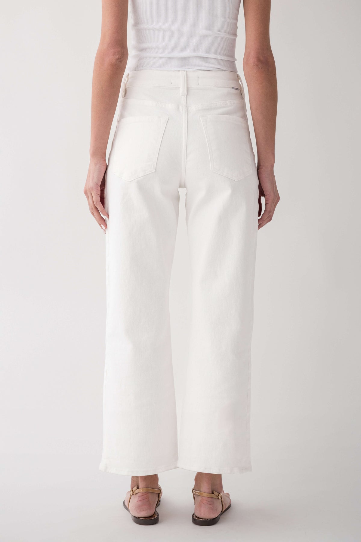 High-rise cream jeans, front view with wide legs and minimal distressing