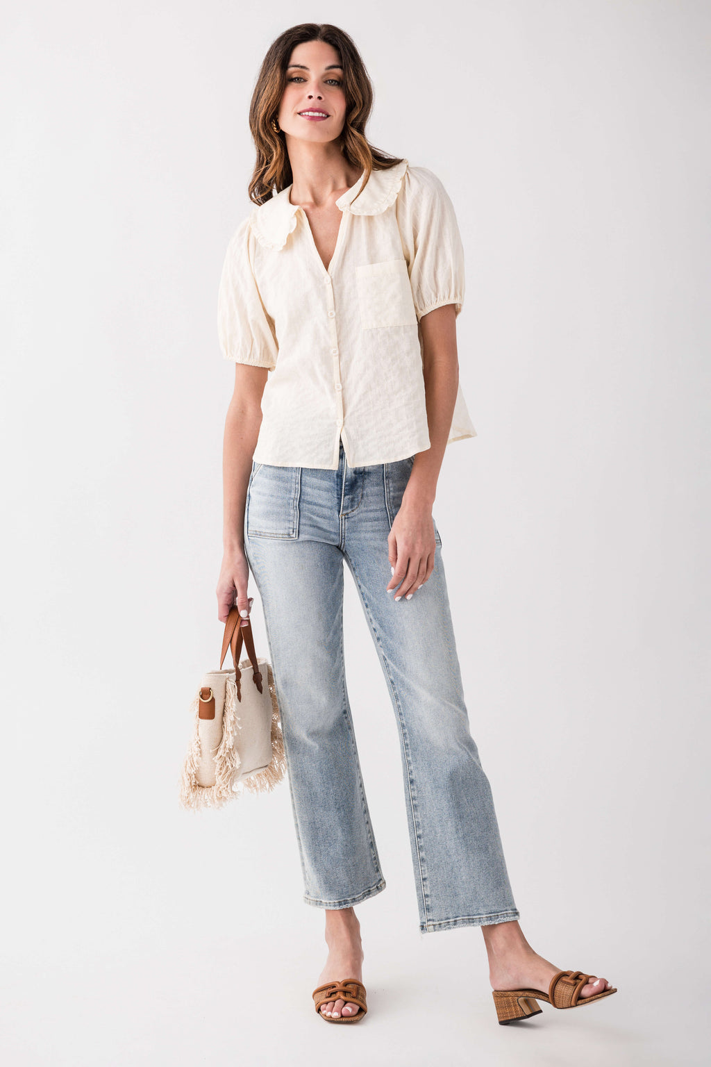 Light blue ankle flare jeans with five-pocket design and cuffed ankle hem