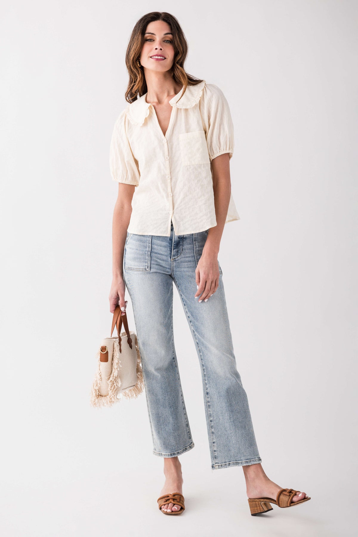 Light blue ankle flare jeans with five-pocket design and cuffed ankle hem