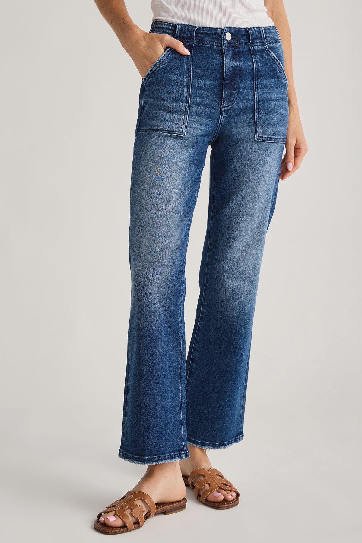 Denim ankle flare jeans with stitched panels, slant front pockets, medium-blue wash
