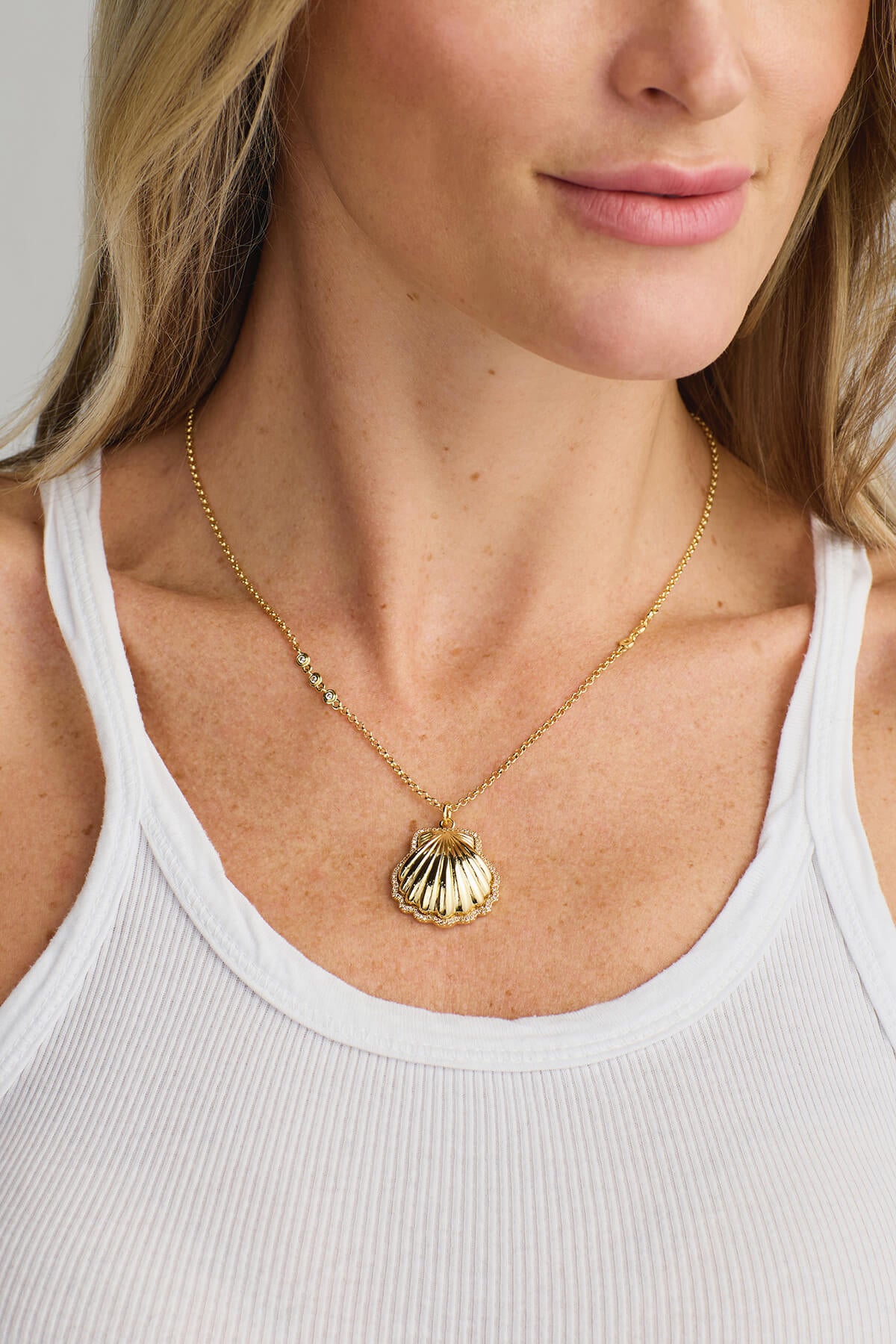 Gold beaded chain necklace with seashell charm pendant