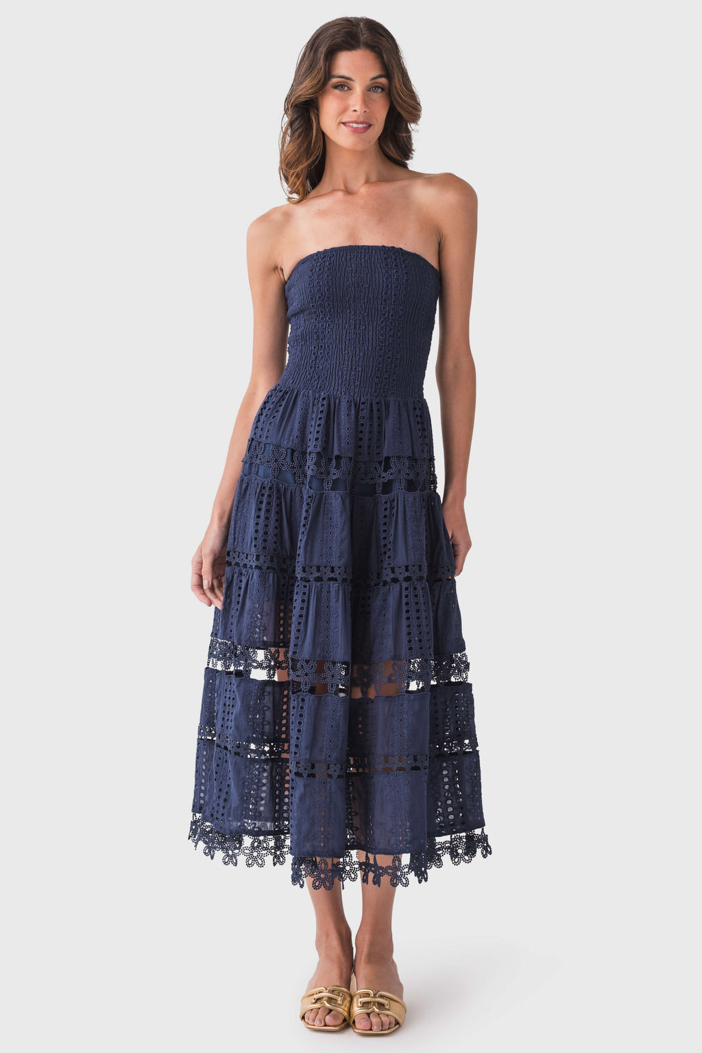 Navy strapless tube dress with tiered eyelet lace skirt and scalloped hem
