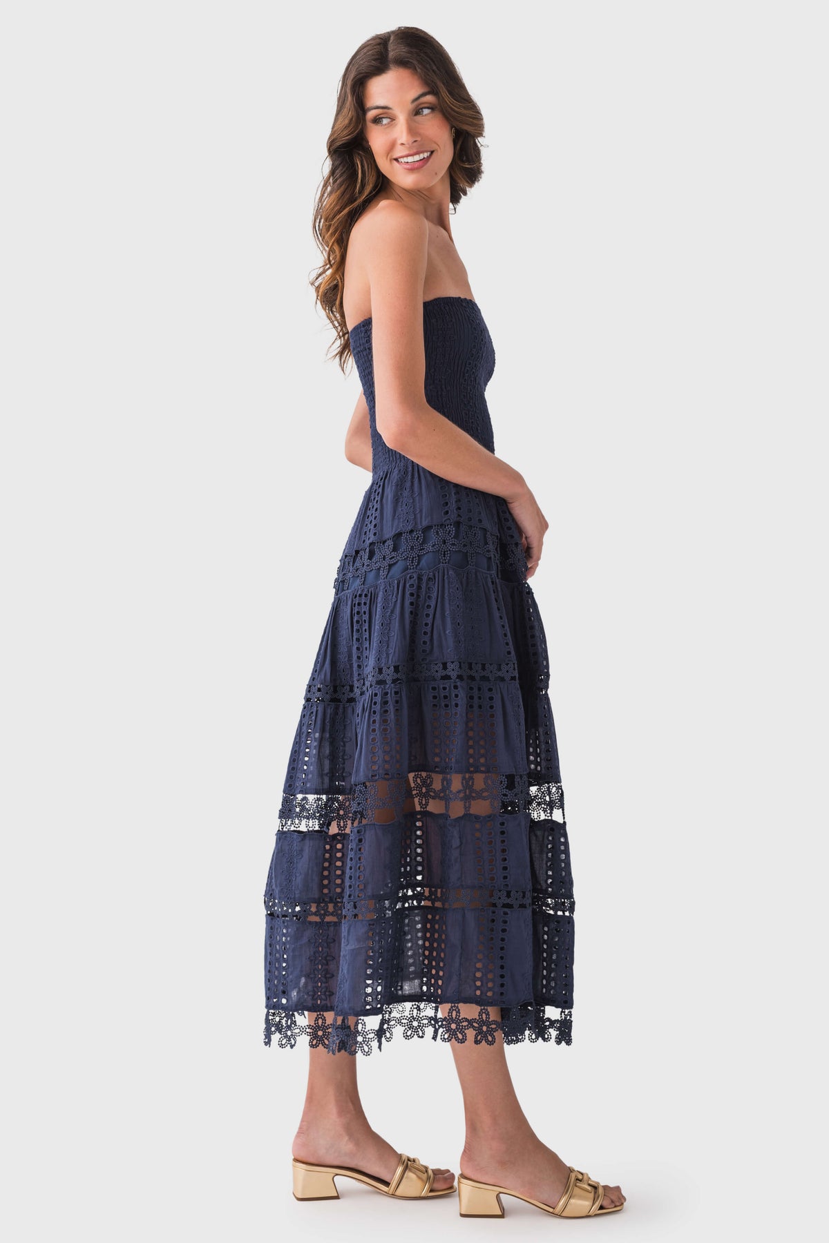 Navy strapless tube dress with tiered eyelet lace and scalloped hem