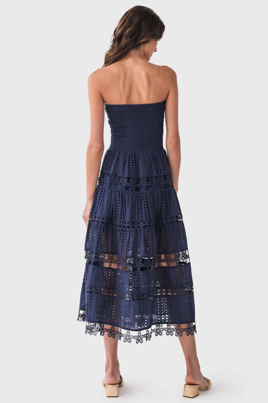 Navy strapless tube dress back view with tiered eyelet lace layers