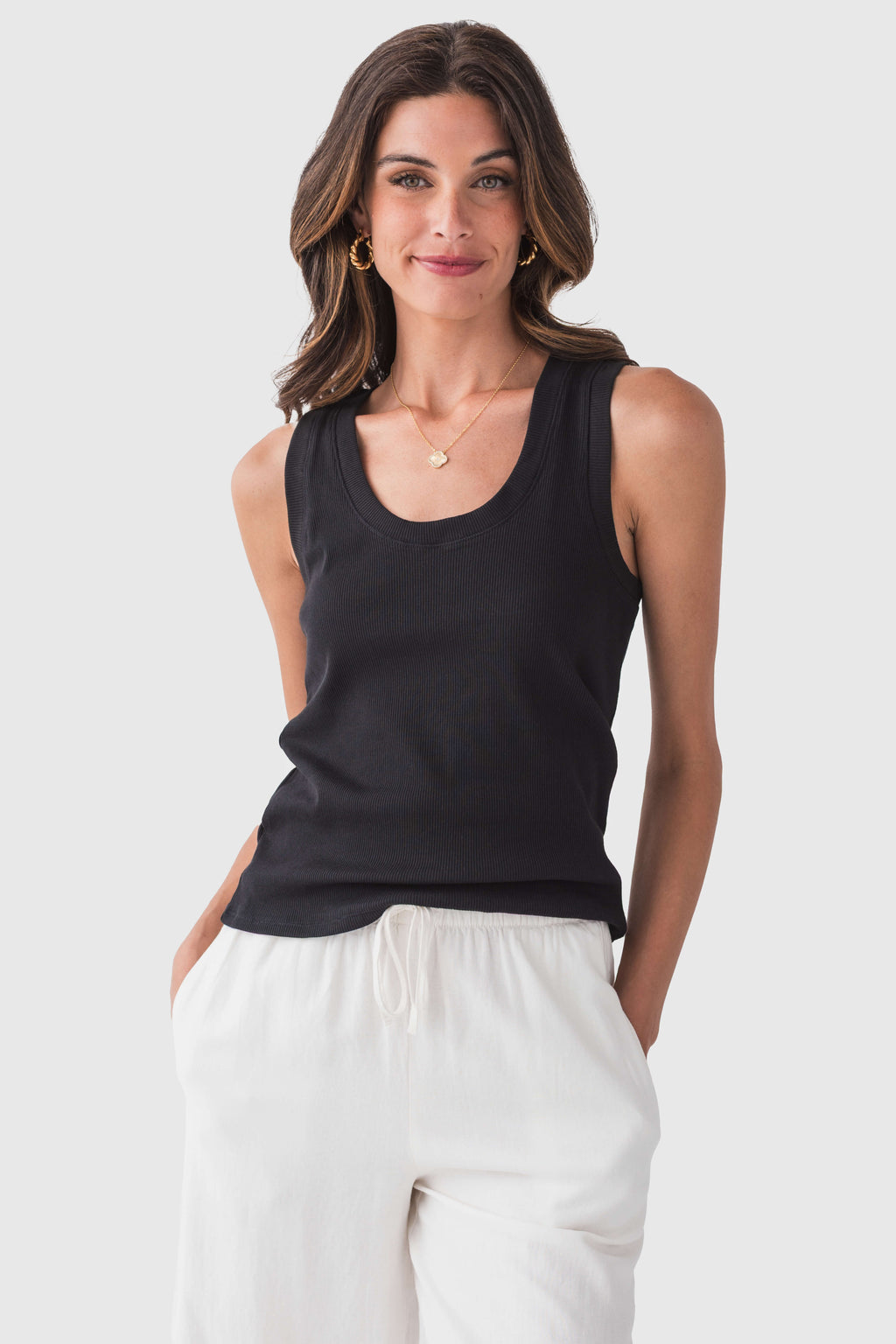 Black ribbed sleeveless tank top with scoop neck and straight hem