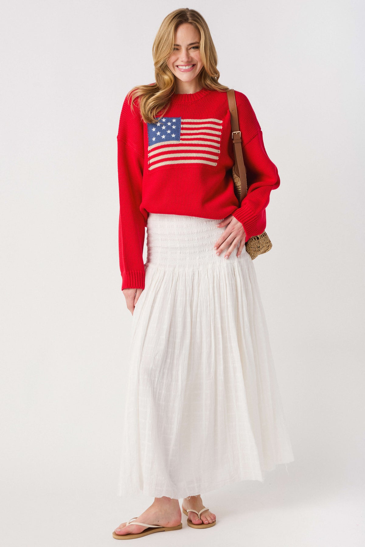 Ivory smocked waistband maxi skirt with tiered, airy fabric