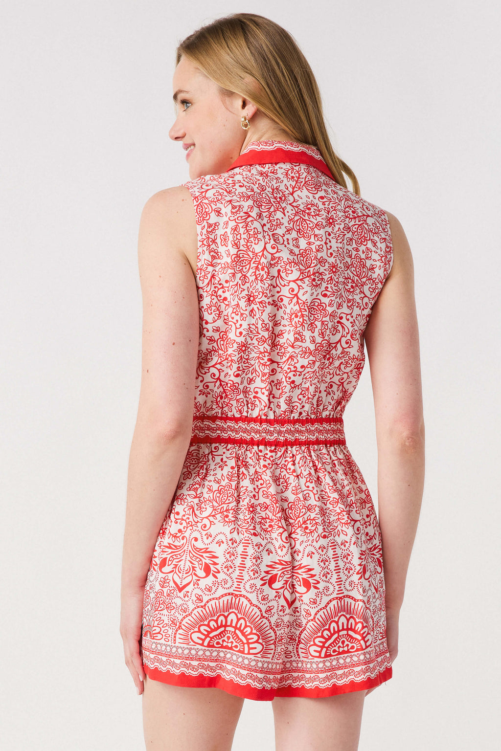 Red and white printed sleeveless romper, back view with waist tie
