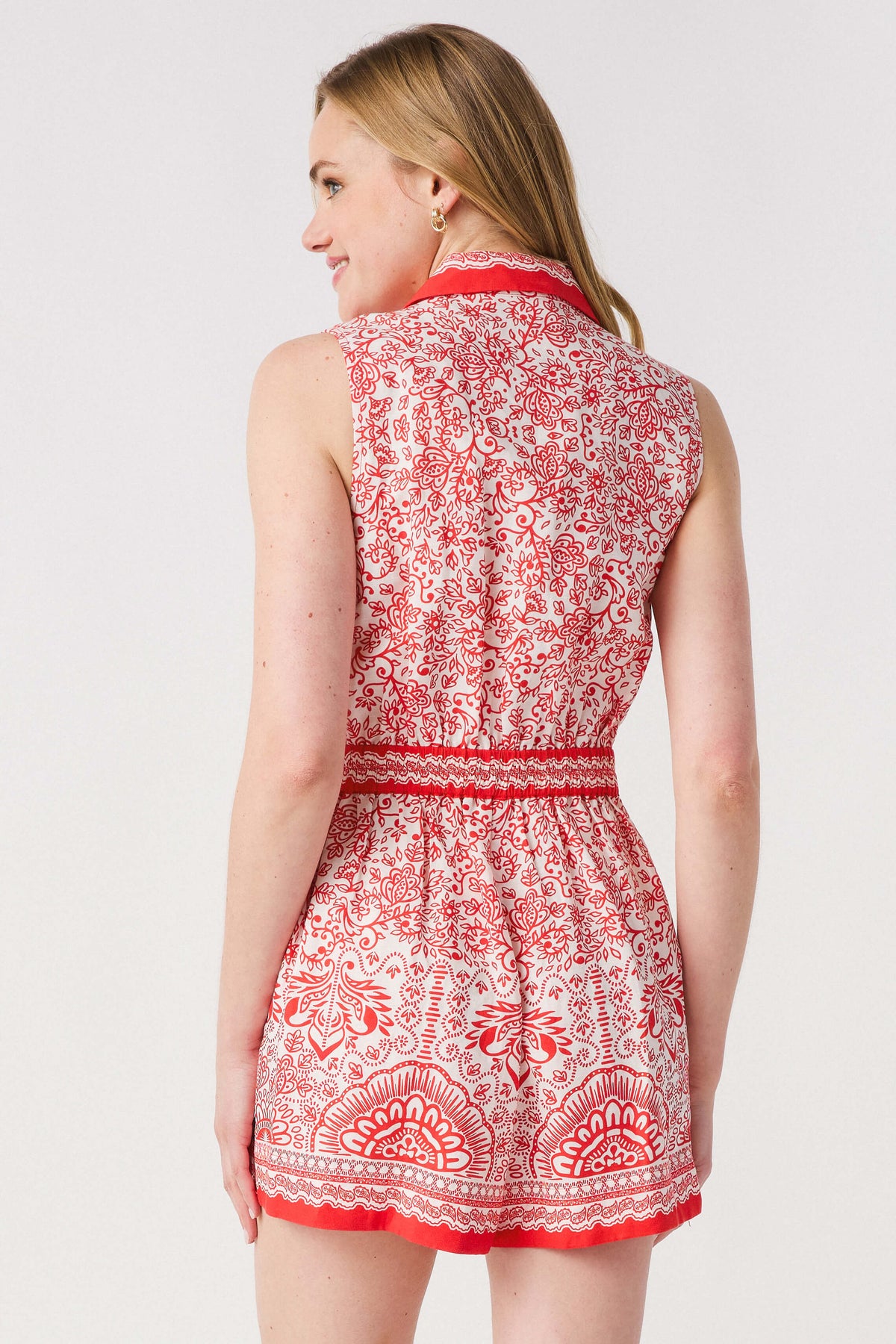 Red and white printed sleeveless romper, back view with waist tie
