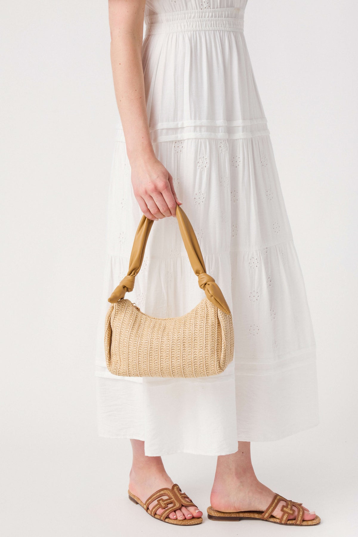 Tan woven top-handle bag with short braided handles