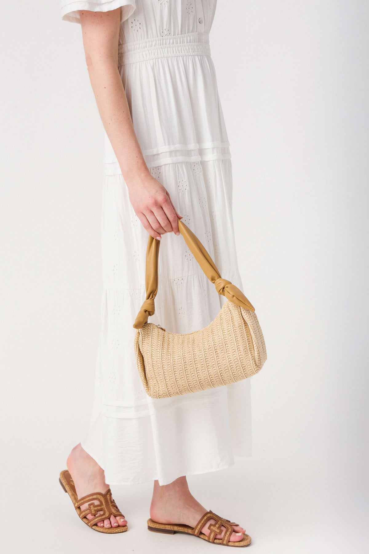 Tan woven top-handle bag with braided rope handles