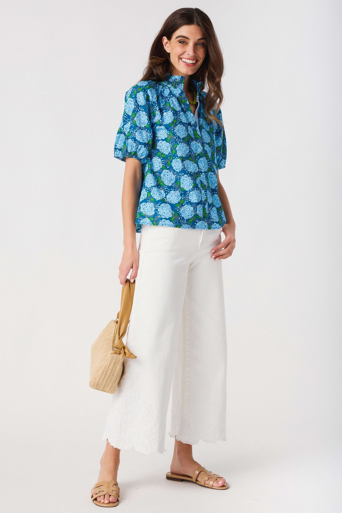 Cream high-rise crop wide-leg pants with scalloped lace hem and loose drape