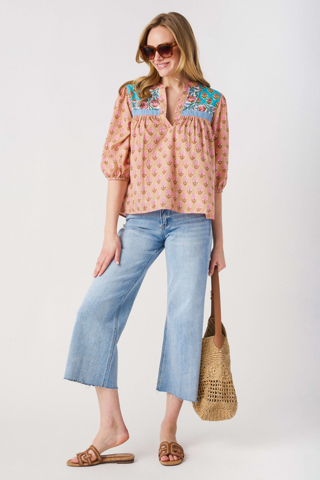 High-rise wide-leg light wash denim jeans with cropped wide leg and belt loops