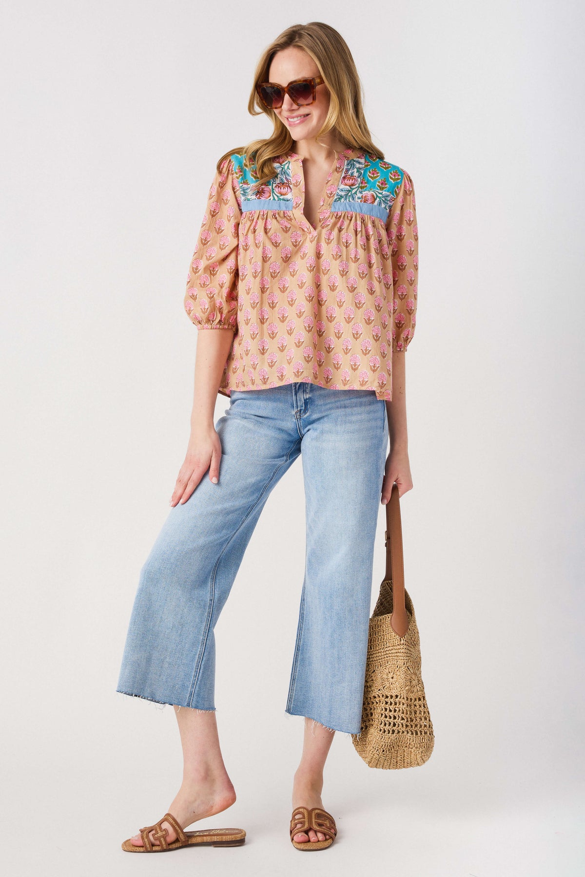 High-rise wide-leg light wash denim jeans with cropped wide leg and belt loops
