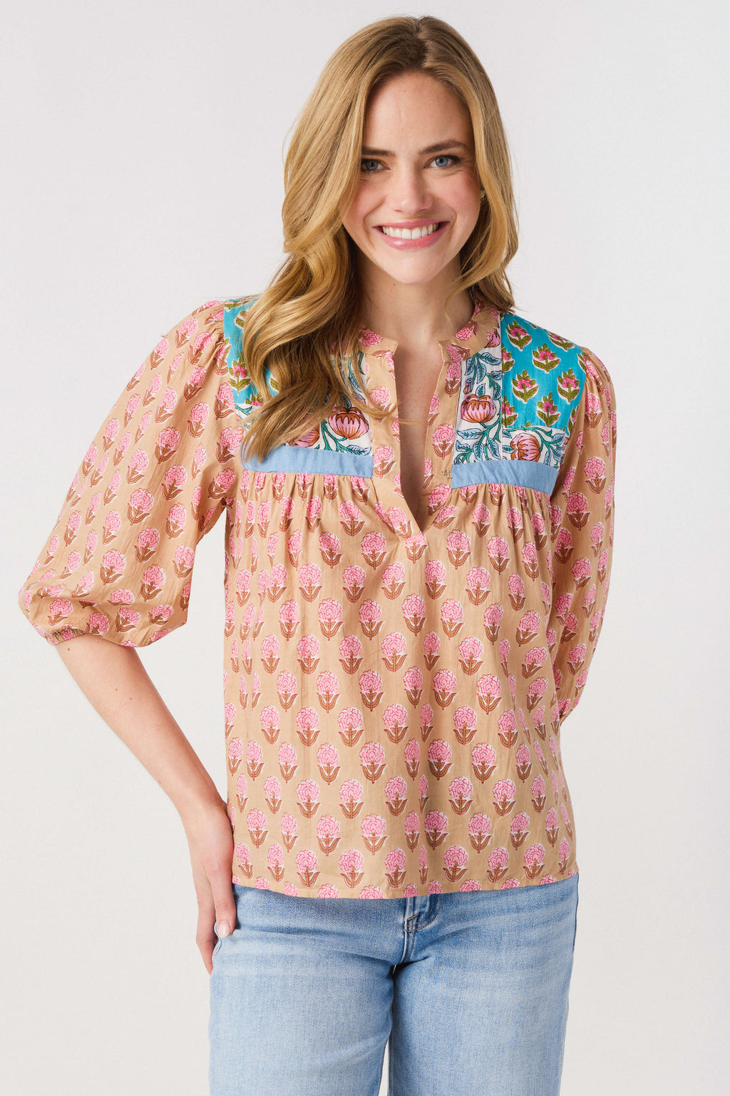 Women’s pink block print peasant top with teal yoke and V neckline