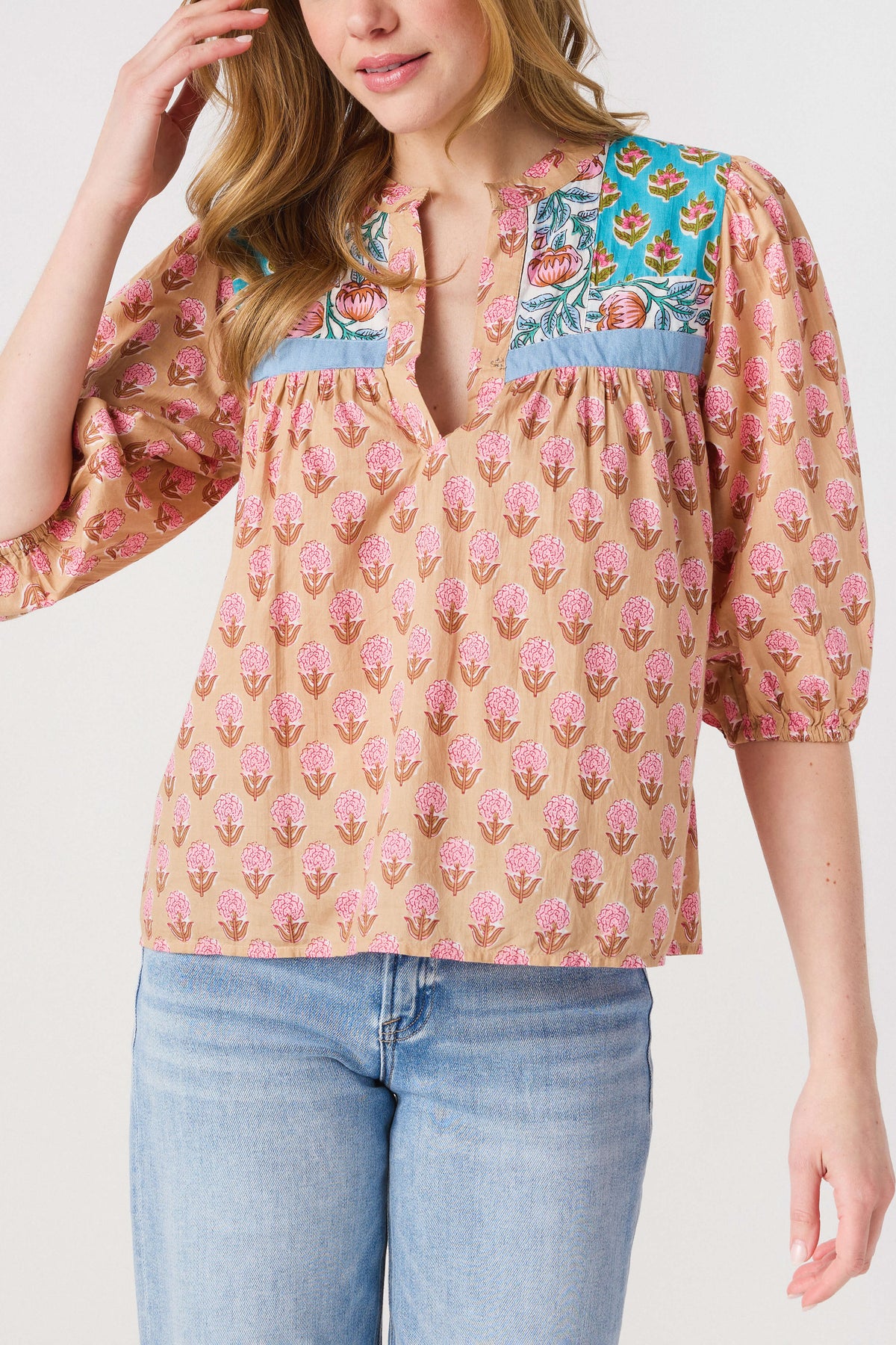 Women’s block print top close-up: pink with teal yoke and keyhole front