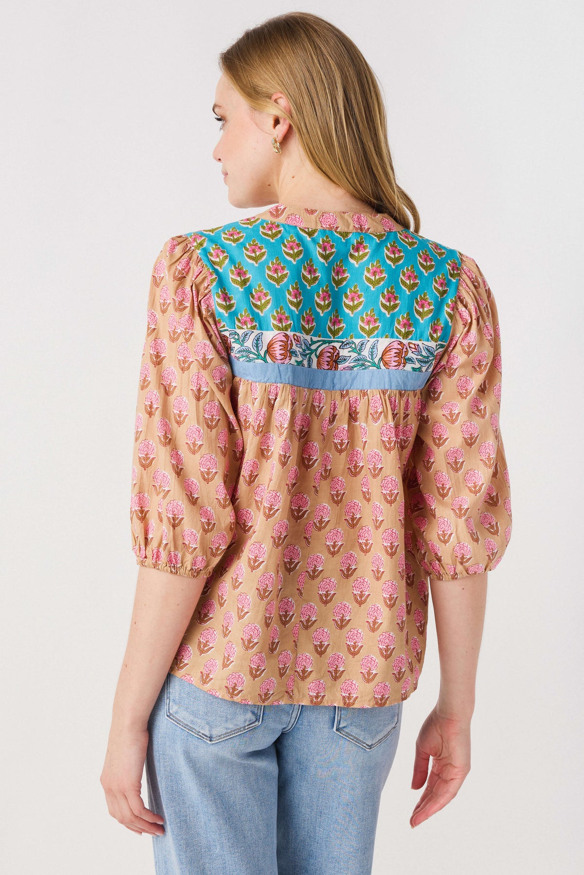 Women’s back of pink block print top with teal yoke and gathered neckline