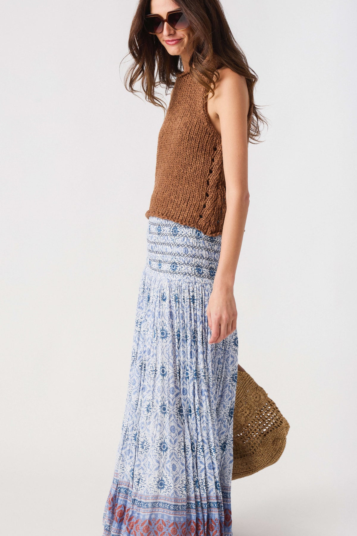 Blue patterned maxi skirt with smocked waist and tiered hem with red border