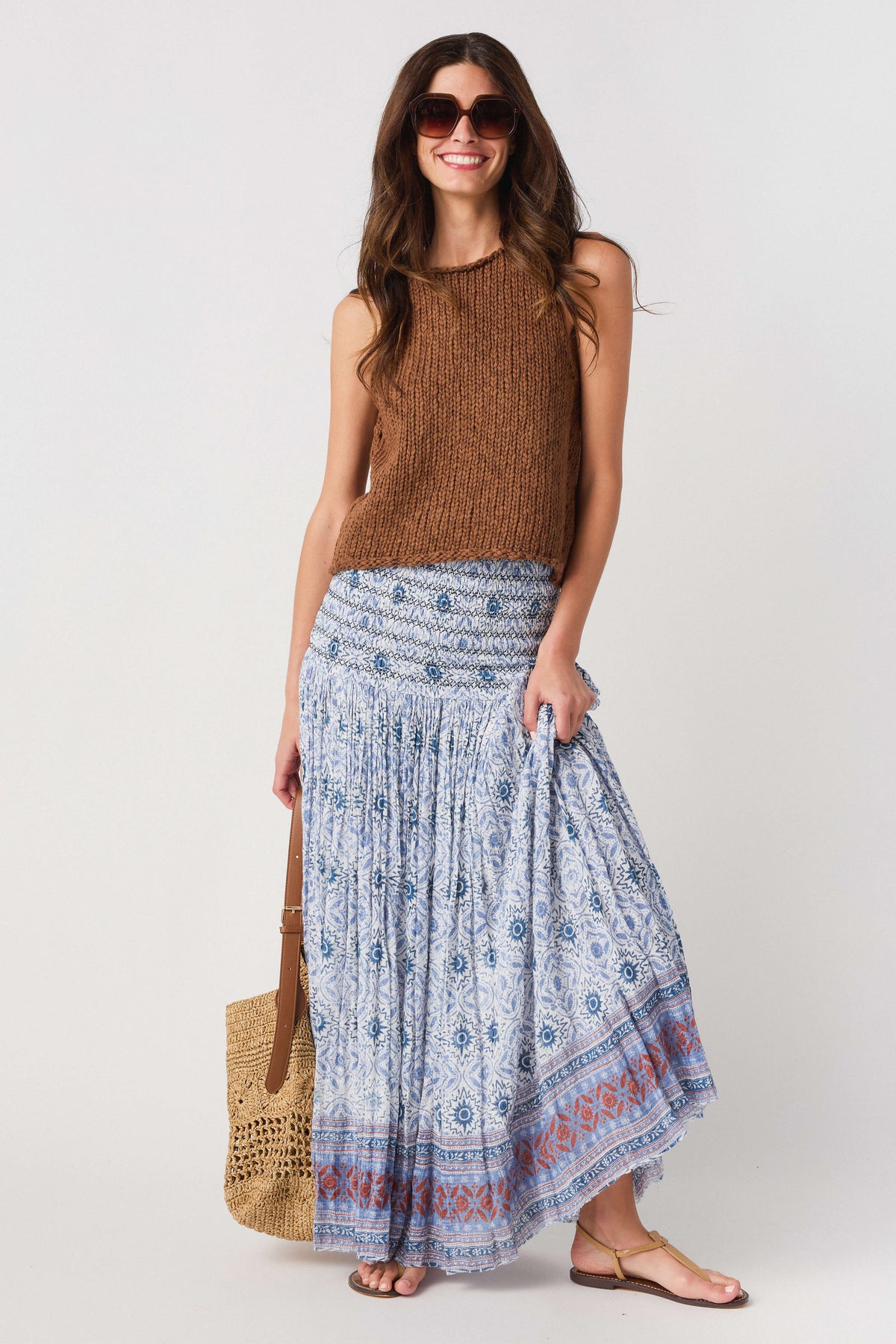 Blue patterned maxi skirt with smocked waist and red-blue border printed hem