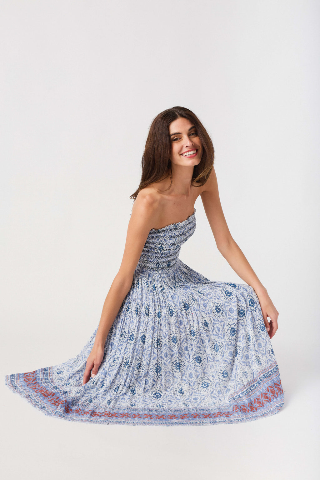 Convertible maxi skirt with blue patterned smocked bodice and flared tiered skirt