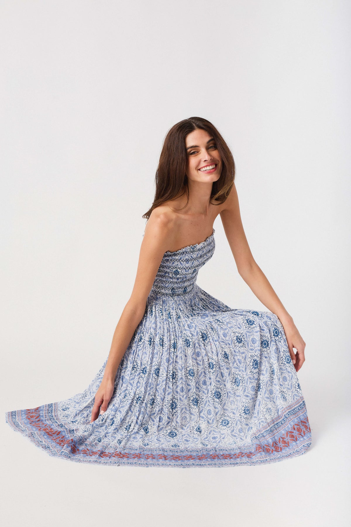Convertible maxi skirt with blue patterned smocked bodice and flared tiered skirt