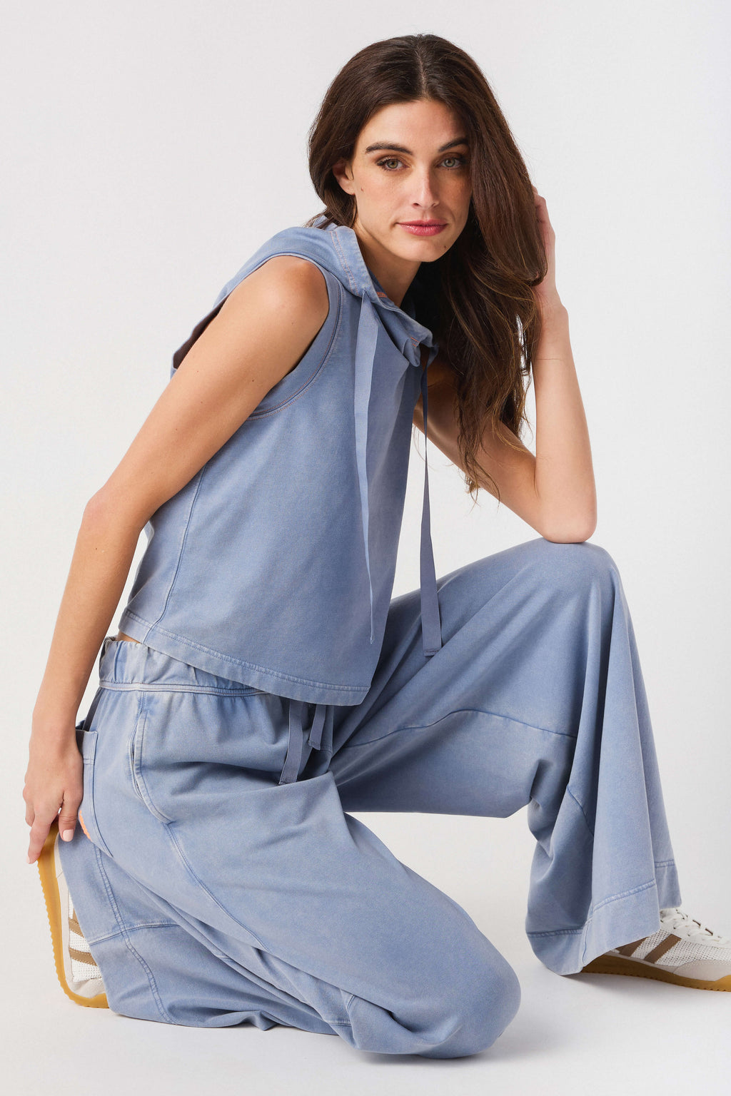 Light blue sleeveless hoodie top and wide-leg pants set, with front pocket details