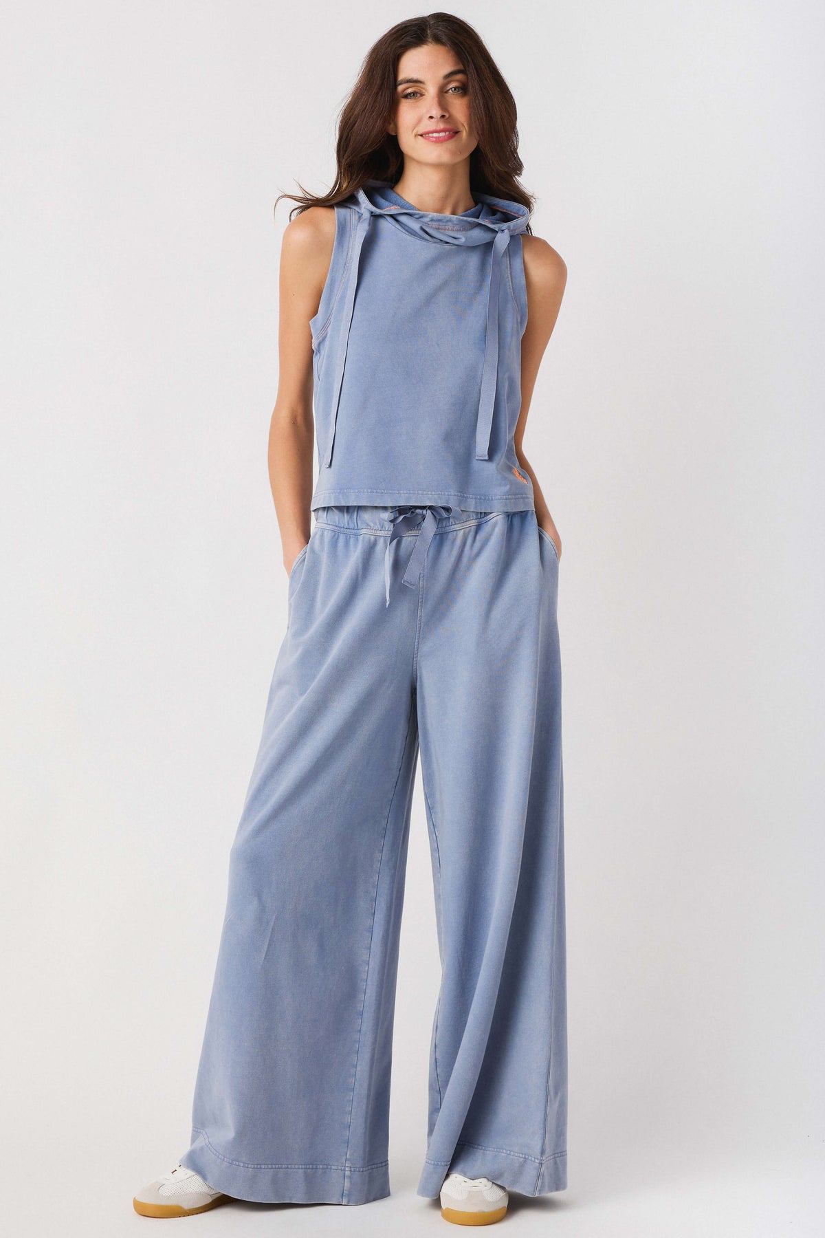 Light blue sleeveless hoodie top and wide-leg pants set, full-length front view