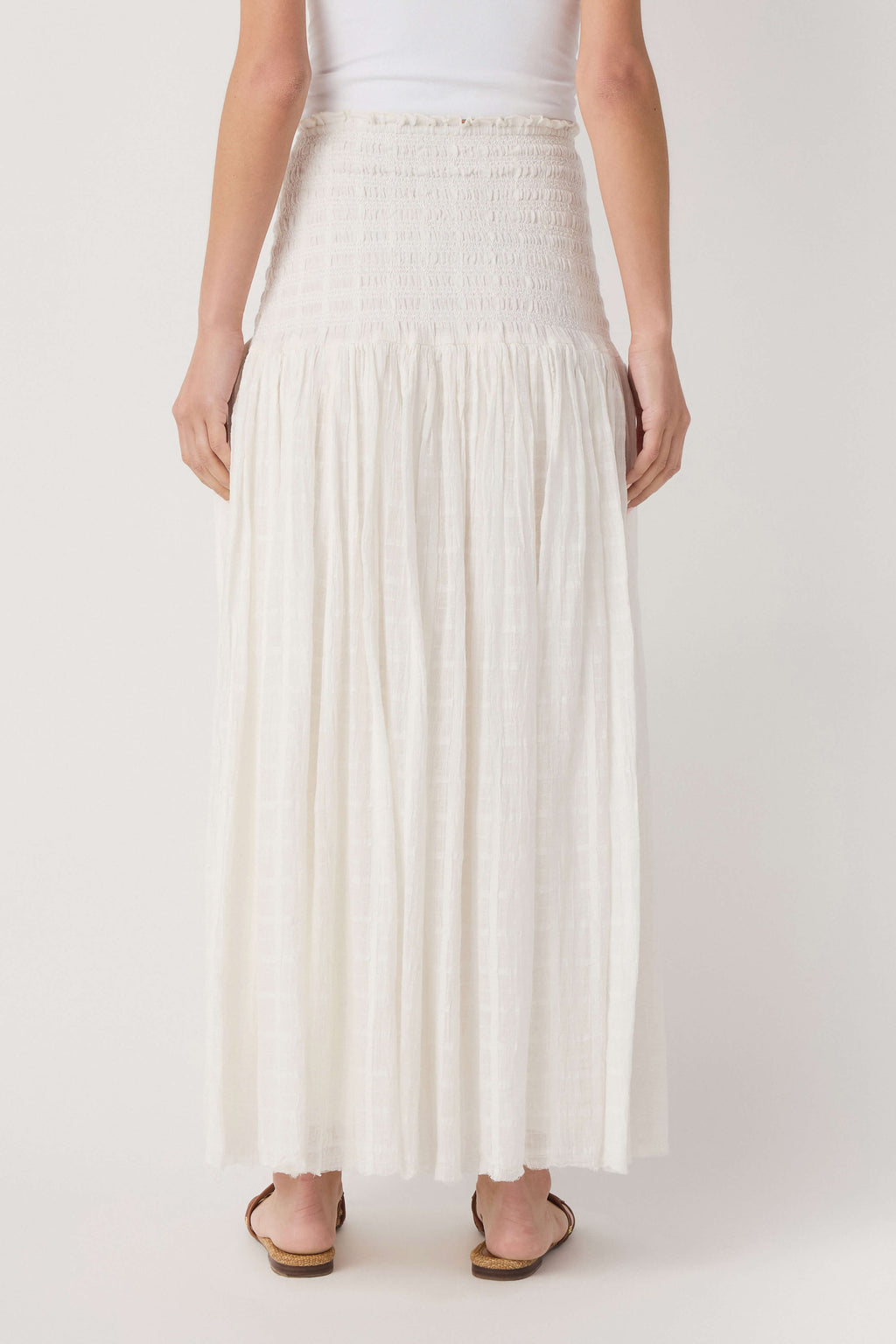 Ivory smocked-waist maxi skirt with cascading tiered ruffles, front view