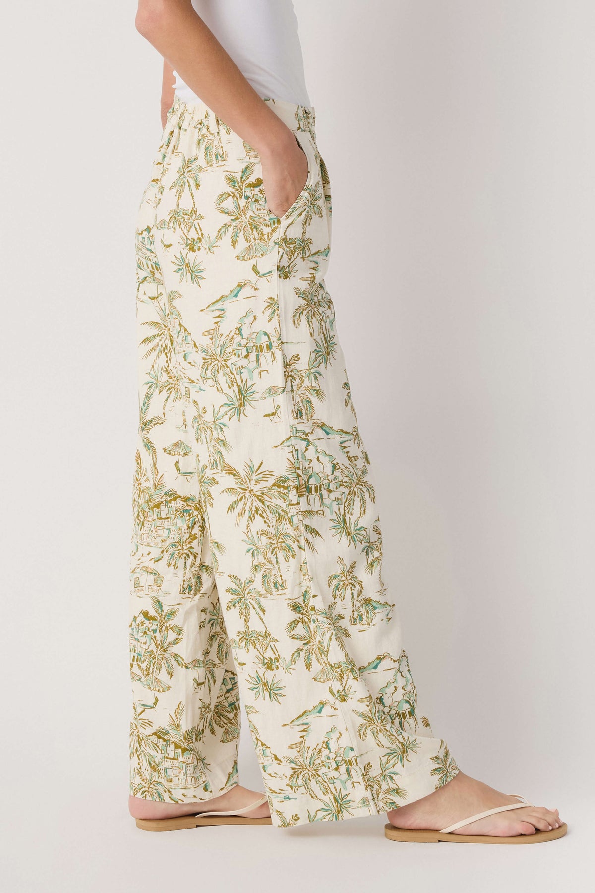 Palm-print linen pants with elastic waistband and wide-leg silhouette, cream