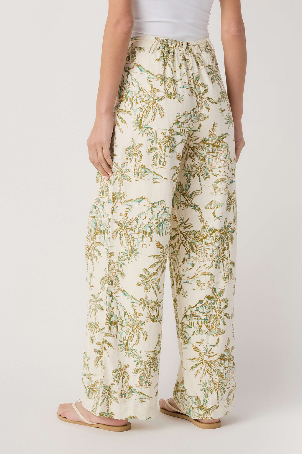 Cream tropical palm-print linen pants with elastic waistband and flowy wide legs