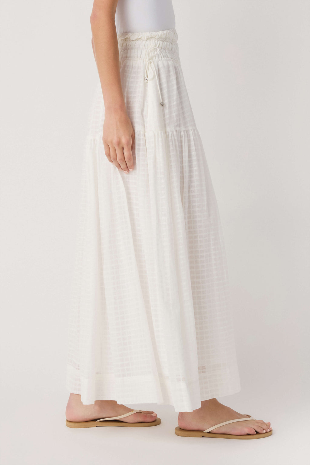 Off-white tiered maxi skirt with smocked waist and layered ruffles
