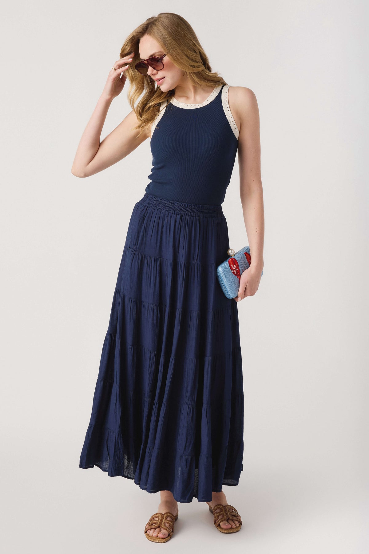 Navy ribbed tank top with contrast lace trim at neckline and armholes