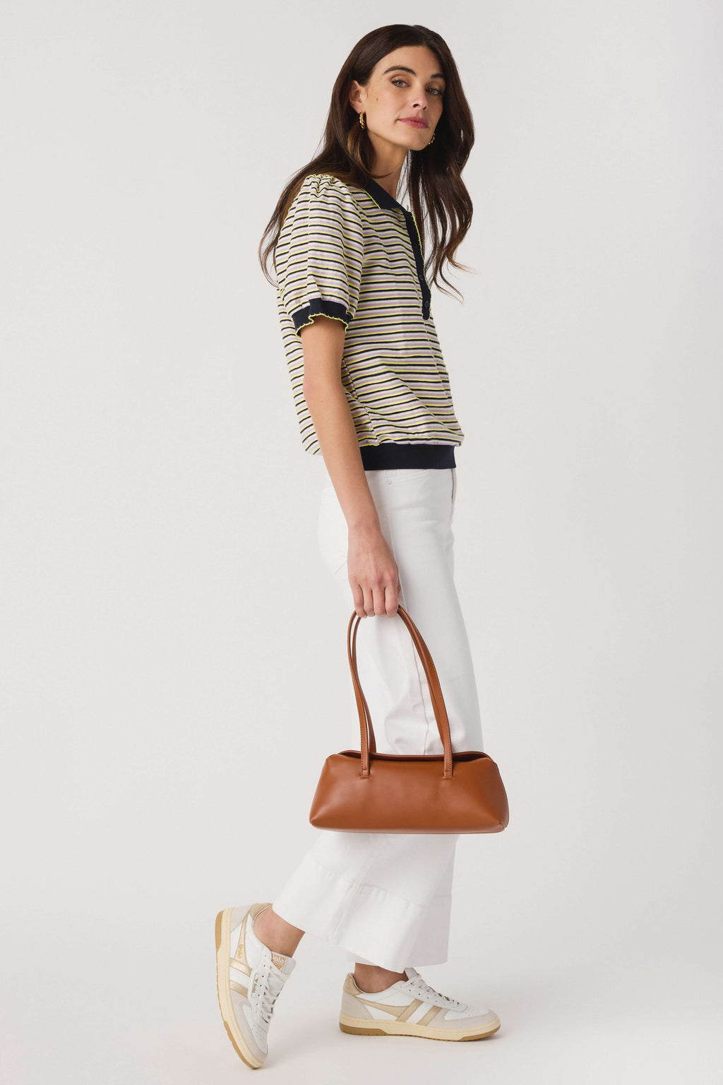 Yellow and navy striped polo top, side view, short sleeves and ribbed hem