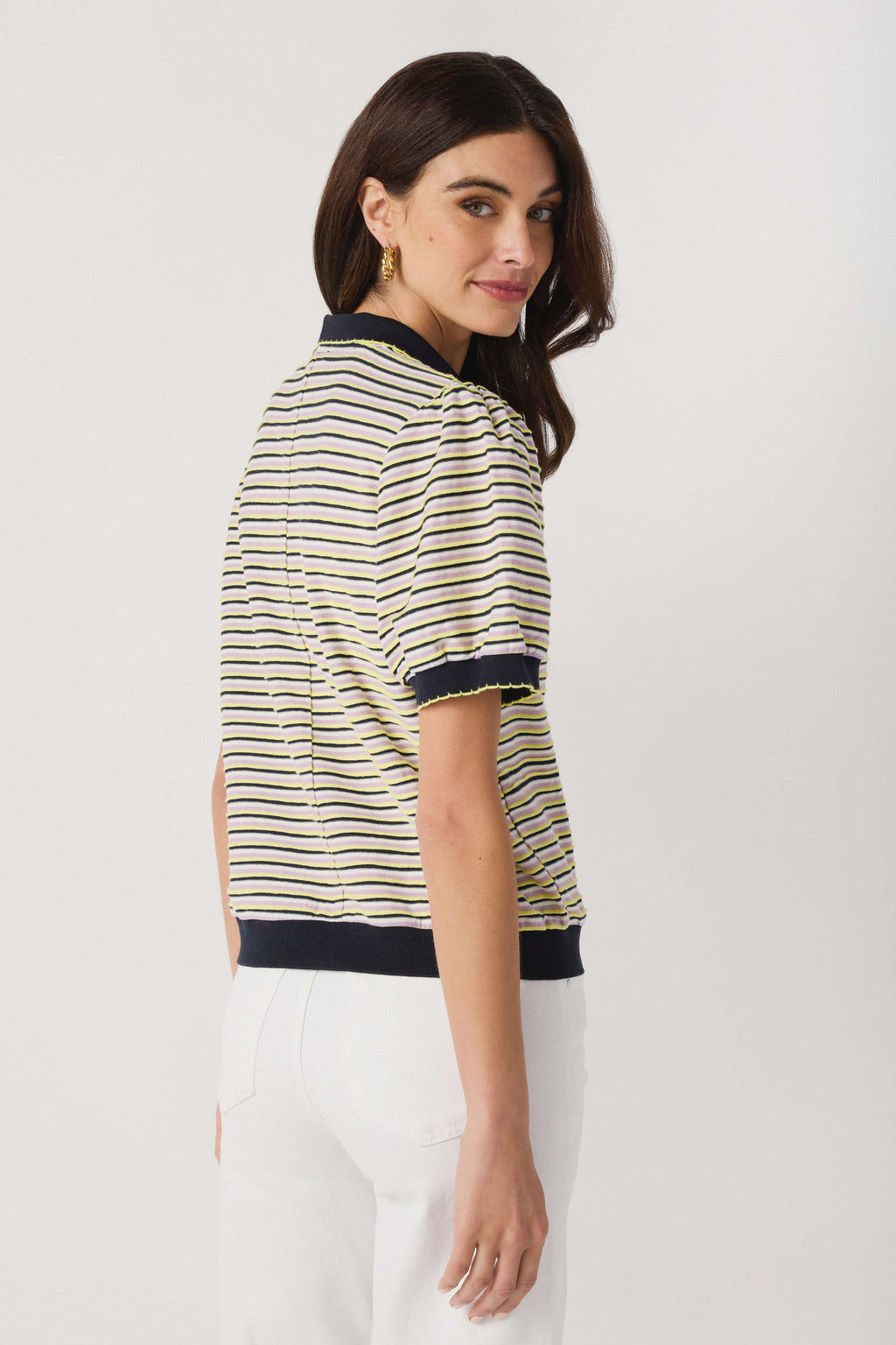 Yellow and navy striped polo top, side profile with ribbed trim at cuffs