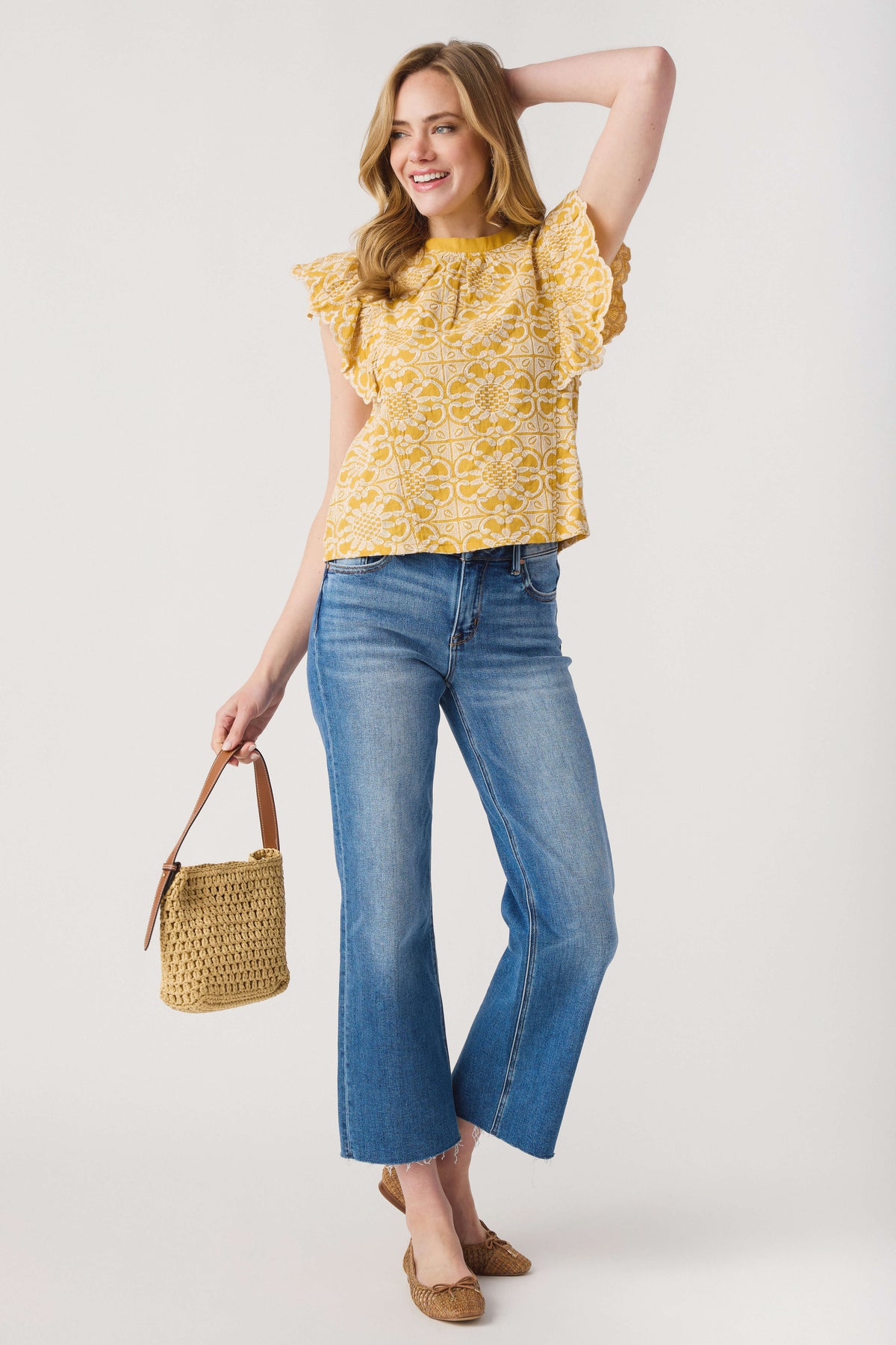 Mustard printed ruffle-sleeve top with high neckline, sleeveless style