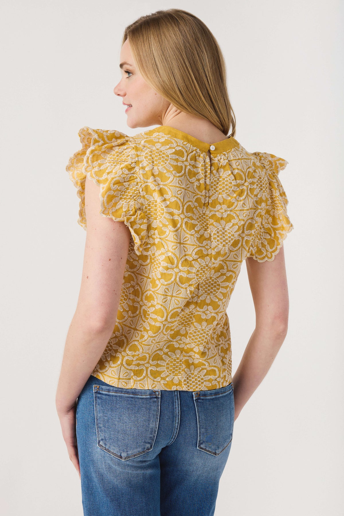 Mustard printed ruffle-sleeve top, back view with yoke detail